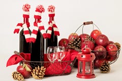 Merry Christmas and happy New year. Bottles of wine in a knitted stock photos Merry Christmas and happy New year. Bottles of wine in a knitted stock photos
