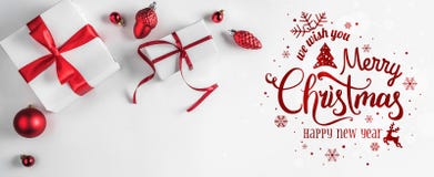 Merry Christmas Typographical on white background with gift boxes and red decoration.