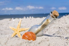 Message in a bottle with wood, chalkboard and maritime decoration stock photos Message in a bottle with wood, chalkboard and maritime decoration stock photos