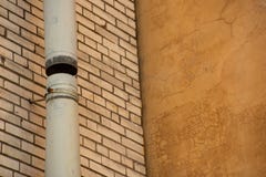Metal Drainpipe On The Wall Royalty Free Stock Photography