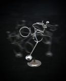 Metal Figure Riding A Bicycle Stock Photo