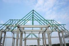 A new build roof with a metal truss framework , color green royalty free stock photo A new build roof with a metal truss framework , color green royalty free stock photo