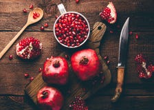 Metal mug full of pomegranate seeds stock images Metal mug full of pomegranate seeds stock images