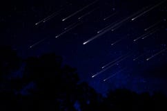 Meteor shower in night sky