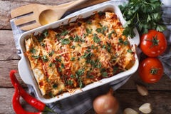 Mexican Enchilada In A Baking Dish Horizontal Top View Close-up Stock Photos Mexican Enchilada In A Baking Dish Horizontal Top View Close-up Stock Photos