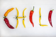 Mexican hot chili peppers colorful mix habanero poblano serrano jalapeno on wood stock photography Mexican hot chili peppers colorful mix habanero poblano serrano jalapeno on wood stock photography