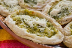 Mexican sopes with grated cheese and green salsa, mexican food spicy in mexico. Memelas stock photos Mexican sopes with grated cheese and green salsa, mexican food spicy in mexico. Memelas stock photos