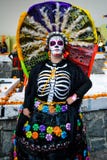 Mexico City, Mexico, ; November 1 2015: Portrait of a woman with colorful hat or penacho in disguise at the Day of the Dead celebr stock photos Mexico City, Mexico, ; November 1 2015: Portrait of a woman with colorful hat or penacho in disguise at the Day of the Dead celebr stock photos