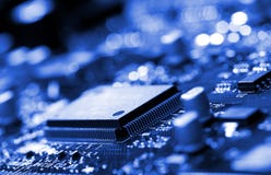 Microchip On Blue Circuit Board Stock Images