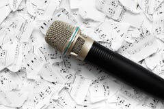 Microphone on the background of notes