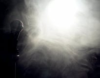Microphone at edge of smoke and fog in light