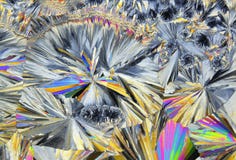 Microscopic view of sucrose crystals in polarized light royalty free stock photography Microscopic view of sucrose crystals in polarized light royalty free stock photography