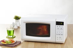 Microwave The Home Appliance Isolated In The Kitchen Interior Stock Photos