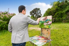 Middle-aged fashionable male painter working on a sketchbook stock images Middle-aged fashionable male painter working on a sketchbook stock images