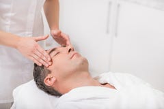 Middle-aged male client getting treatment at beauty salon royalty free stock images Middle-aged male client getting treatment at beauty salon royalty free stock images