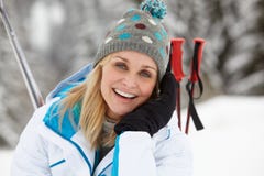 Middle Aged Woman On Ski Holiday In Mountains stock photos Middle Aged Woman On Ski Holiday In Mountains stock photos