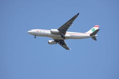 A airplane of MEA Airlines flying in the sky stock photography A airplane of MEA Airlines flying in the sky stock photography