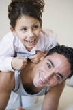 A Middle Eastern man playing with his daughter stock images A Middle Eastern man playing with his daughter stock images