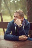 Midlife crisis man thinking portrait sitting outside Royalty Free Stock Photography Midlife crisis man thinking portrait sitting outside Royalty Free Stock Photography