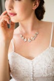 Midsection of beautiful bride wearing necklace Stock Images Midsection of beautiful bride wearing necklace Stock Images