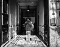 Milan, Italy - March 23, 2016: Young man goes to narrow italian royalty free stock photography Milan, Italy - March 23, 2016: Young man goes to narrow italian royalty free stock photography