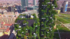 Milan, Italy - September 26, 2018: Aerial view. Modern and ecologic skyscrapers with many trees on every balcony. Bosco