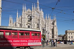 Piazza del Duomo in Milan with people and trams. The facade of t royalty free stock image Piazza del Duomo in Milan with people and trams. The facade of t royalty free stock image