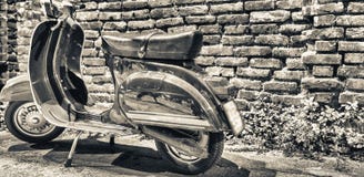 MILANO, ITALY - SEPTEMBER 25, 2015: Old Vespa Parked Along Navigli At Night. Vespa Is An Old Italian Motorbike Stock Images MILANO, ITALY - SEPTEMBER 25, 2015: Old Vespa Parked Along Navigli At Night. Vespa Is An Old Italian Motorbike Stock Images