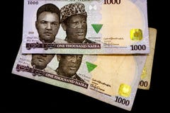 Mille notes nigériennes de Naira sur un fond noir simple images libres de droits Mille notes nigériennes de Naira sur un fond noir simple images libres de droits