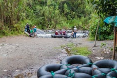 Group of tourists is preparing for tubing. stock photo Group of tourists is preparing for tubing. stock photo