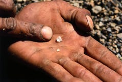 Miner hands rough diamond