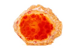 Mineralisk orange agat för makro i kristaller på vit bakgrund Arkivfoto Mineralisk orange agat för makro i kristaller på vit bakgrund Arkivfoto