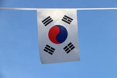 Mini fabric rail flag of South Korea, a white rectangular background, a red and blue Taeguk, symbolizing balance. royalty free stock image Mini fabric rail flag of South Korea, a white rectangular background, a red and blue Taeguk, symbolizing balance. royalty free stock image