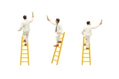 Painter standing on wooden ladder and painting wall with paint tools isolated on white background. royalty free stock photo Painter standing on wooden ladder and painting wall with paint tools isolated on white background. royalty free stock photo