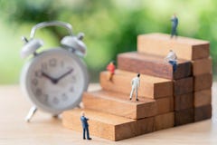 Miniature people businessmen standing Investment Analysis Or in royalty free stock images Miniature people businessmen standing Investment Analysis Or in royalty free stock images