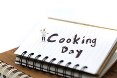 Miniature people : chef cooking using for concept of Cooking day stock photography Miniature people : chef cooking using for concept of Cooking day stock photography