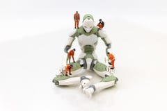 Miniature people : Engineering is developing an AI robot system, using labor instead of people. Image use for new technology in royalty free stock images Miniature people : Engineering is developing an AI robot system, using labor instead of people. Image use for new technology in royalty free stock images