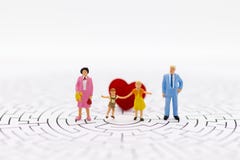 Miniature people: The family consists of parents and children. Image use for family day stock image Miniature people: The family consists of parents and children. Image use for family day stock image