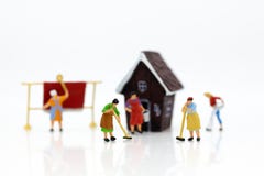 Miniature people: Housekeepers clean the house. Image use for cleaning occupations, business concept royalty free stock photos Miniature people: Housekeepers clean the house. Image use for cleaning occupations, business concept royalty free stock photos