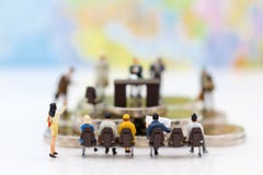 Miniature people: Recruiter interview applicants. Image use for background Choice of the best suited employee, Royalty Free Stock Photos Miniature people: Recruiter interview applicants. Image use for background Choice of the best suited employee, Royalty Free Stock Photos