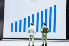 Miniature people small figures businessmen stand and look at the royalty free stock photos Miniature people small figures businessmen stand and look at the royalty free stock photos