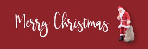 Miniature Santa Claus and gifts bag with Merry Christmas text with copy space royalty free stock photo Miniature Santa Claus and gifts bag with Merry Christmas text with copy space royalty free stock photo