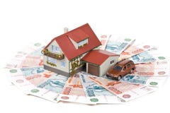 Miniaturhaus und Geld. Miniaturhaus und Geld.