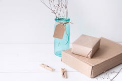 Minimal elegant composition with turquoise vase and craft boxes