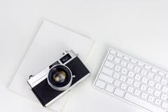 Minimal white workspace with vintage camera stock images Minimal white workspace with vintage camera stock images