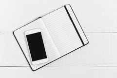 Minimally styled home office desk with Smart Phone stock photography Minimally styled home office desk with Smart Phone stock photography