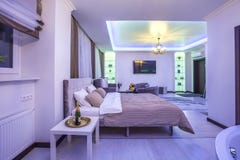 MINSK, BELARUS - January, 2019: luxure hall interior loft flat apartments in neon light stock image MINSK, BELARUS - January, 2019: luxure hall interior loft flat apartments in neon light stock image