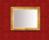 Mirror on red wall