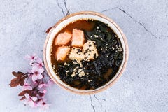 Miso soup with tofu and salmon