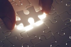Missing jigsaw puzzle piece with light glow stock photos Missing jigsaw puzzle piece with light glow stock photos